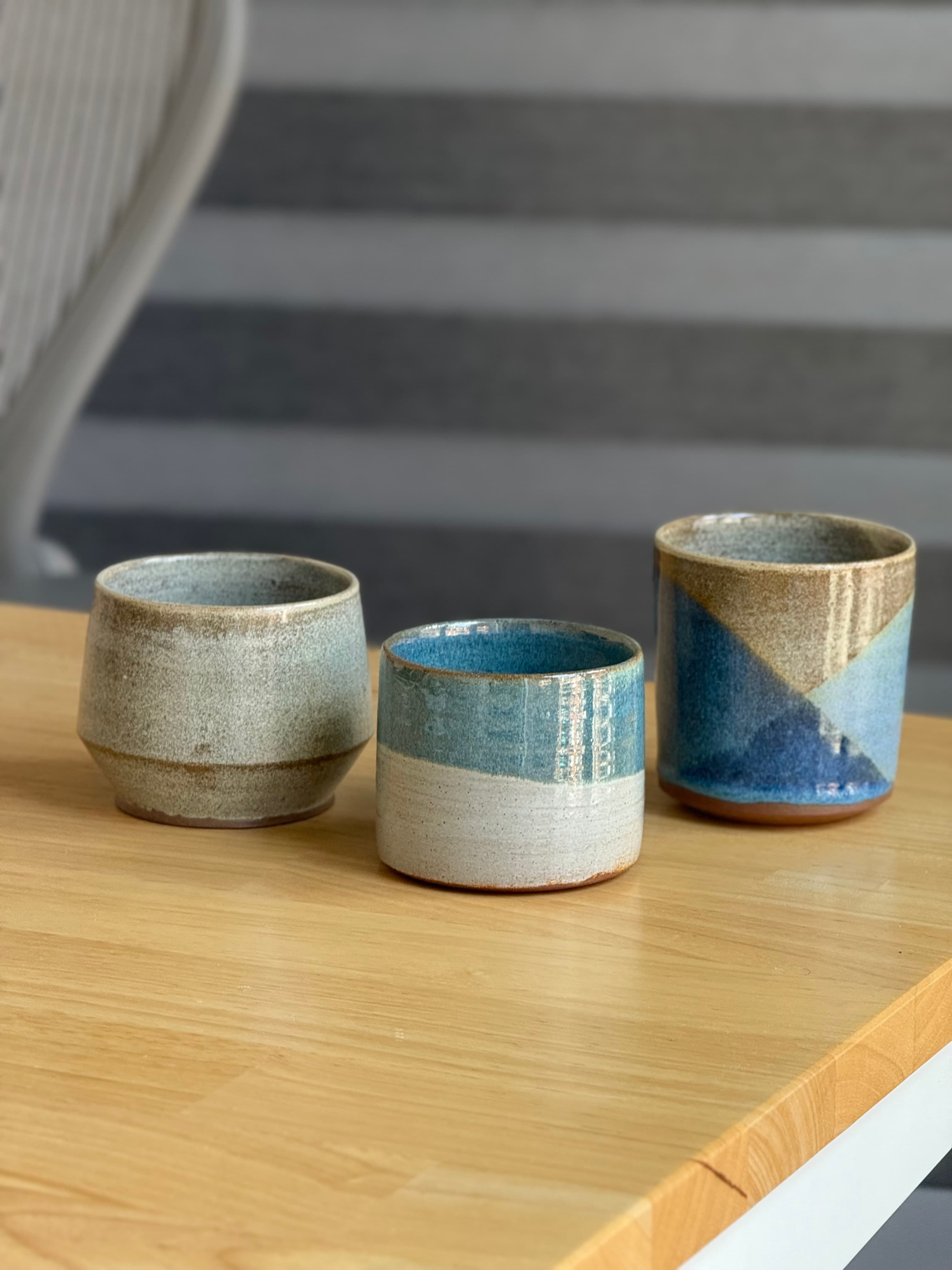 Three handleless mugs